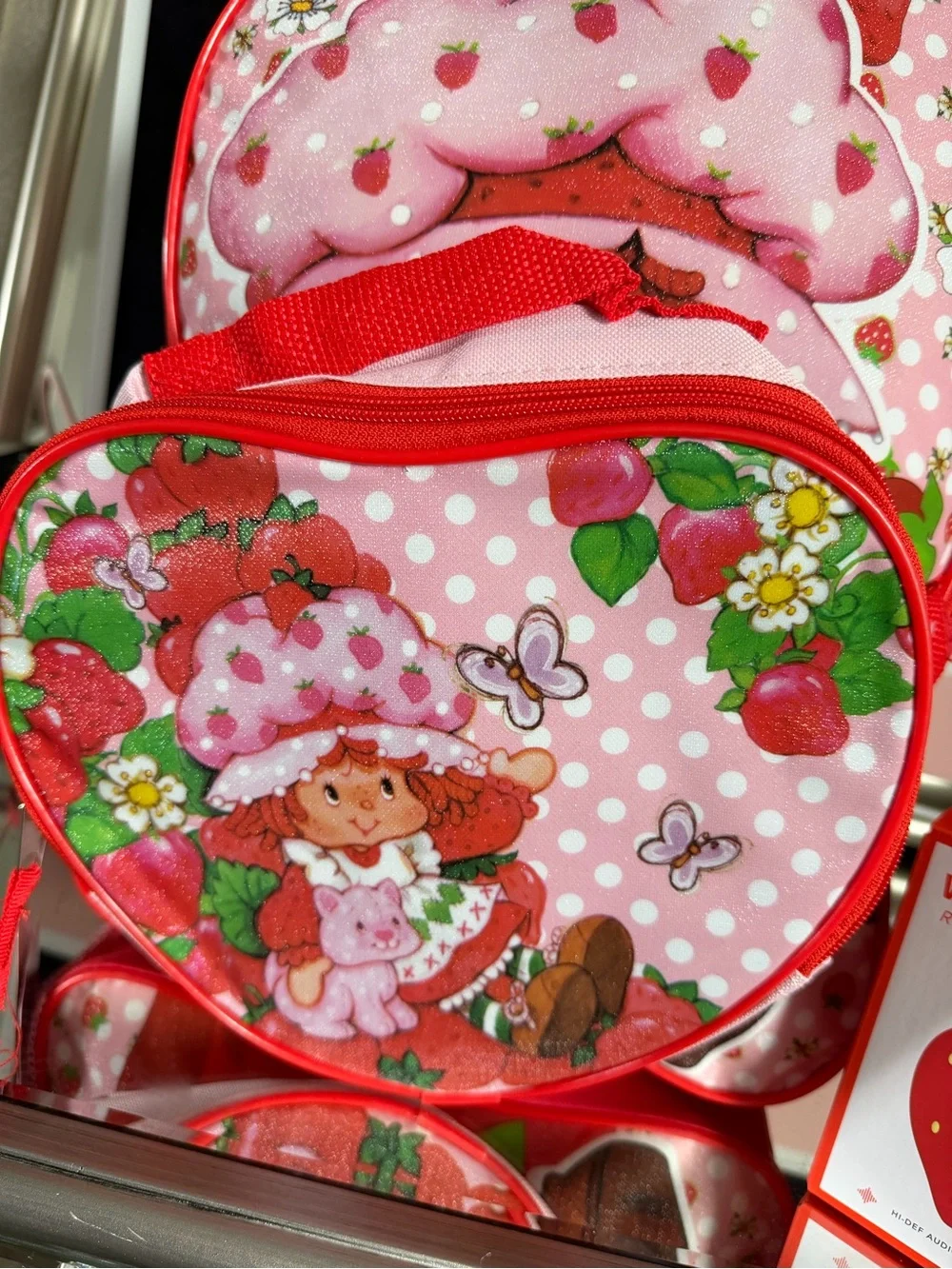 Pink Strawberry Kids Backpack with Lunchbox and a strawberry wireless speaker